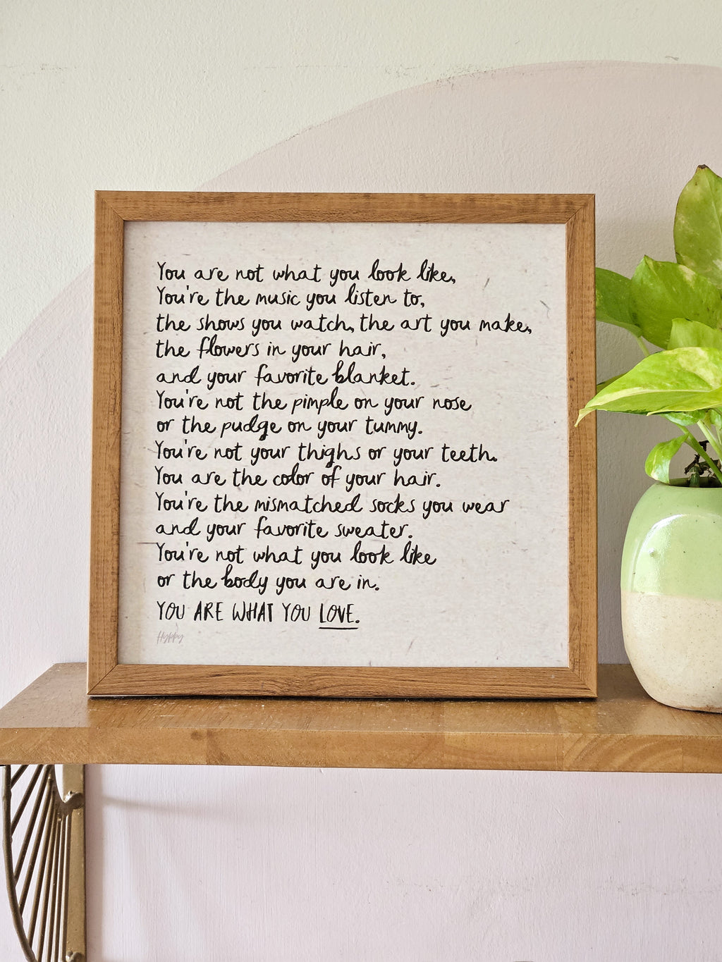 Close-up of the typography and paper texture on the print, adding handcrafted charm.

