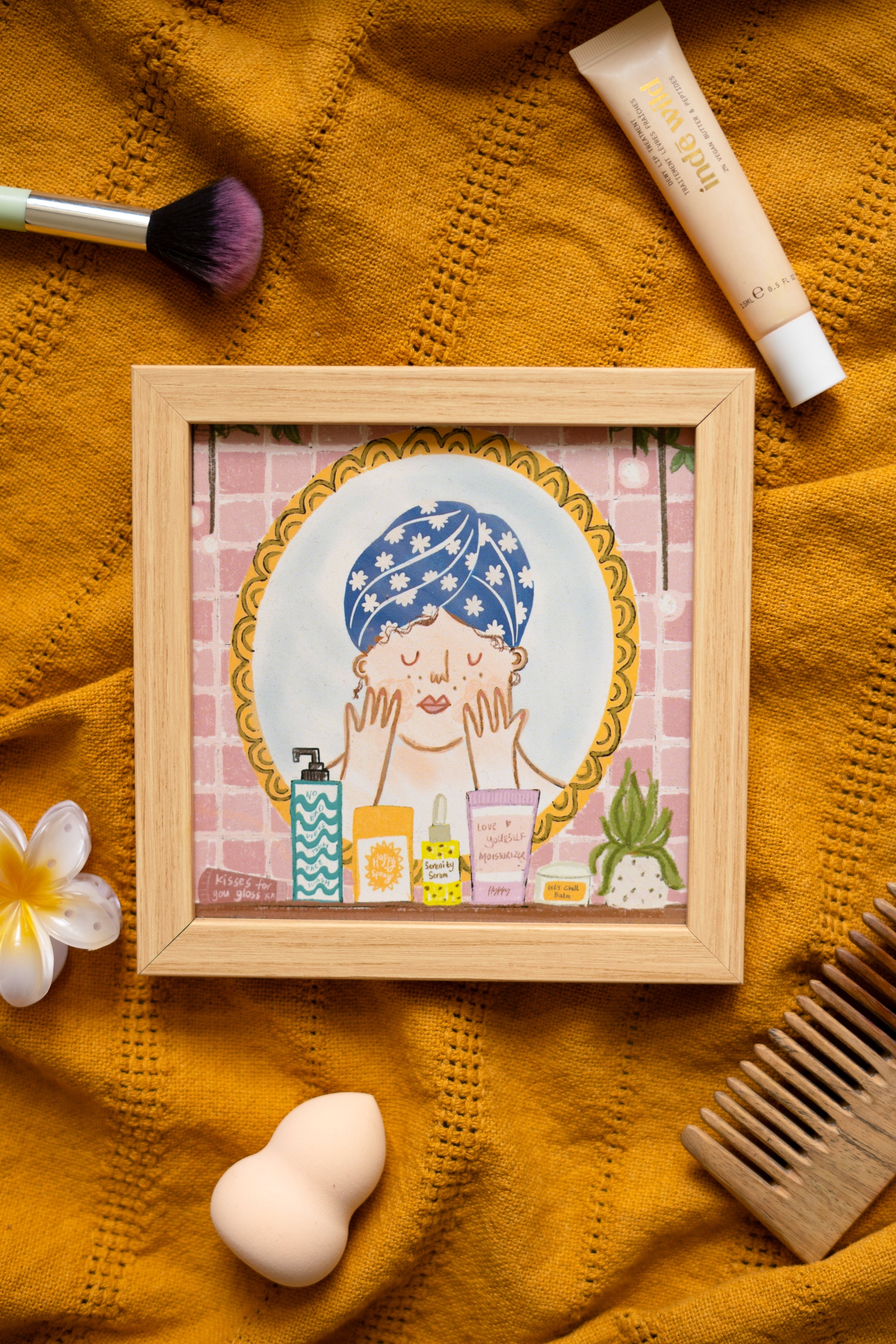 Flat lay of AM PM illustration beside coffee, flowers, and skincare, showing its lifestyle vibe.

