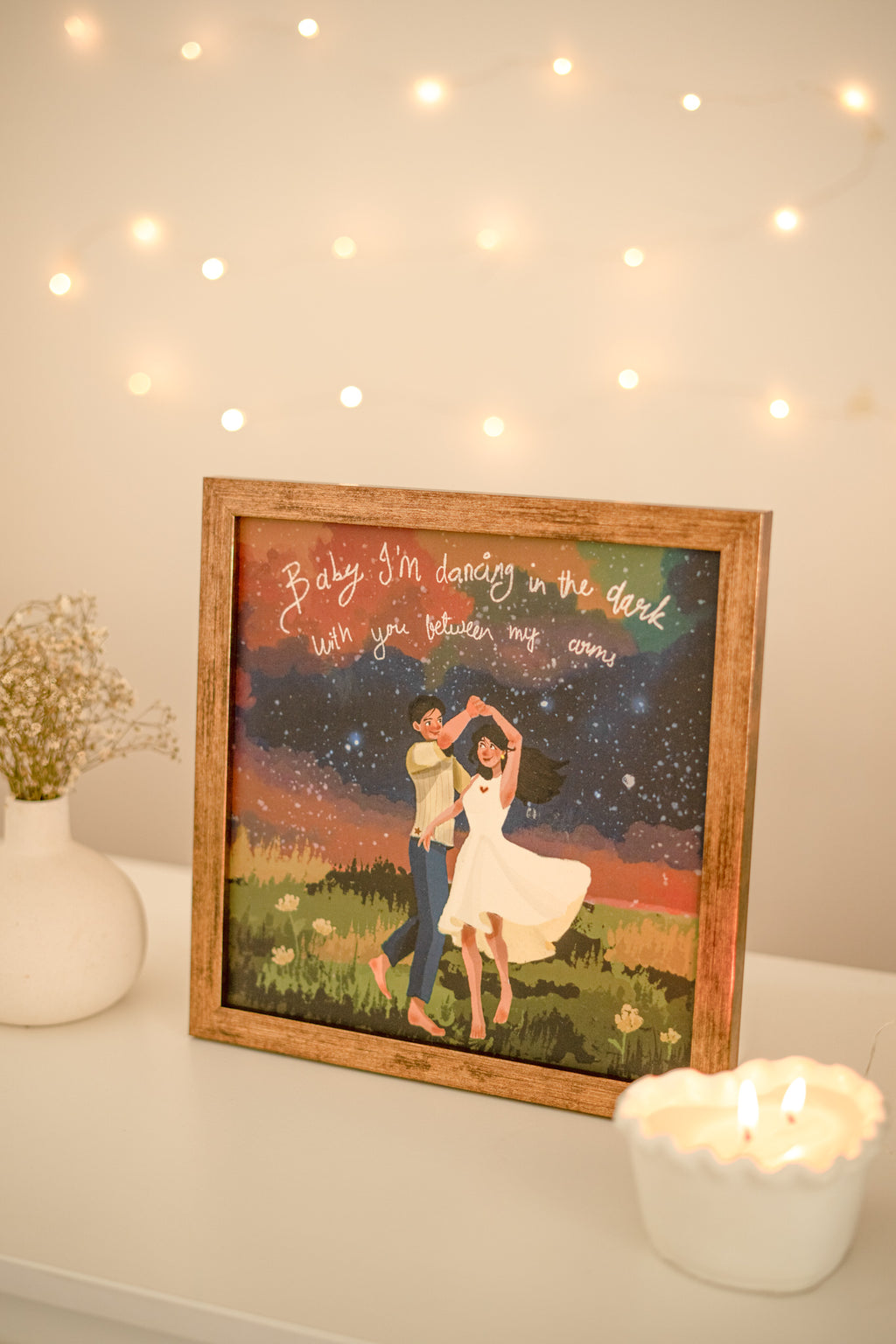 Dancer silhouette print paired with cozy home elements for a contemporary, artistic corner.

