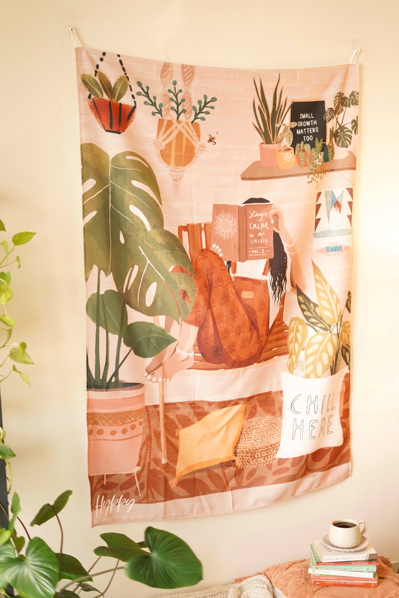 Side angle of the Boho Tapestry displayed above a wooden chair with a beige throw, adding a cozy and inviting atmosphere to the space.

