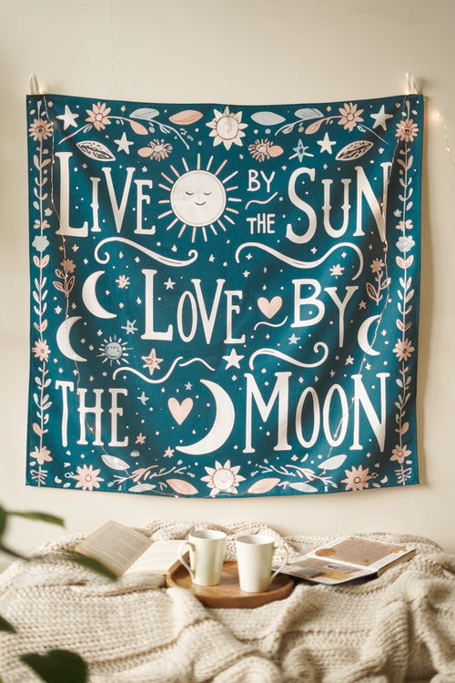 Cotton wall tapestry featuring bold red “Live and Love” typography on a warm beige backdrop. Adds warmth and intention to cozy spaces.

