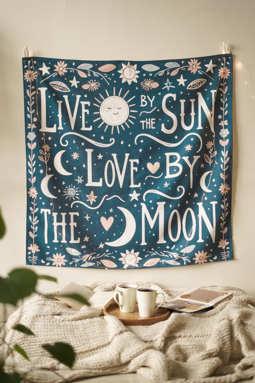 Cotton wall tapestry featuring bold red “Live and Love” typography on a warm beige backdrop. Adds warmth and intention to cozy spaces.

